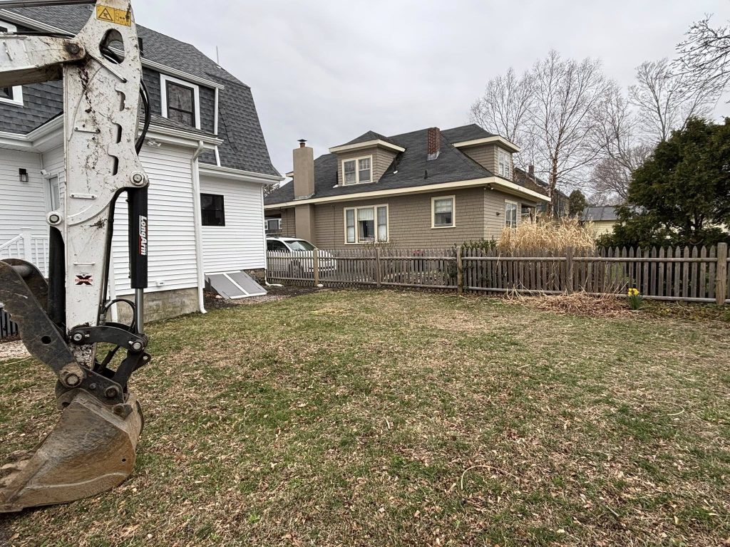 Excavation and lawn preparation work for residential landscaping and curb appeal improvement project
